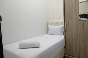 Simply and Clean 2BR Apartment at Vida View Makassar By Travelio