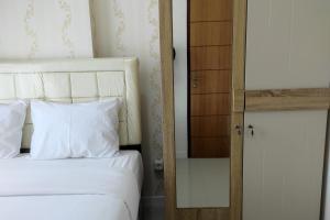 Simply and Clean 2BR Apartment at Vida View Makassar By Travelio