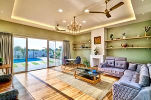 SaffronStays Six Oaks - 6BR Lakeside Villa with Pool, Games Room & Backwater Views