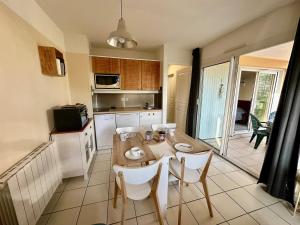 Appartements nid douillet au milieu des pins entre lac et ocean : photos des chambres