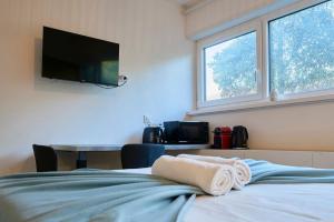 Appartements Studio tout confort : photos des chambres