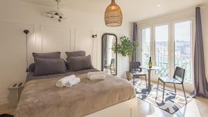 Appartements Le Reflet Secret - Hypercentre - Balneo : photos des chambres