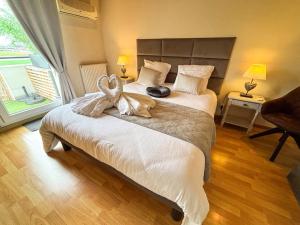 Appartements Le Green Field Lodge - Parking Gratuit - Standing - Centre Ville - Commerces a Proximite : photos des chambres