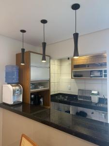 Apto com piscinas e pé na areia