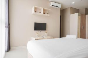 Elegant 2BR Ciputra International Apartment near Puri Indah Mall By Travelio
