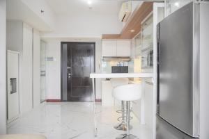 Warm and Comfort Living 1BR at 8th Ambassade Kuningan Apartment By Travelio