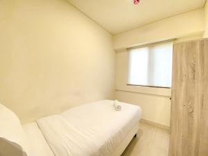 Fully Furnished and Homey 3BR at Meikarta Apartment By Travelio