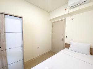 Fully Furnished and Homey 3BR at Meikarta Apartment By Travelio