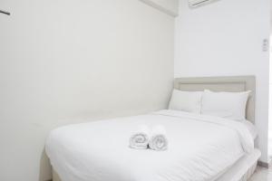 Restful and Simply Studio Apartment Green Palm Residence By Travelio