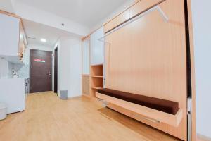 Minimalist Studio Room near Campus at Pacific Garden Alam Sutera Apartment By Travelio