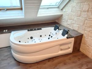 Appartements L-Opale - Sauna et Jacuzzi : photos des chambres