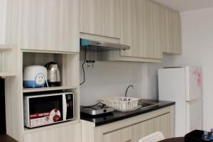 Warm and Cozy Studio at Azalea Suites Apartment By Travelio