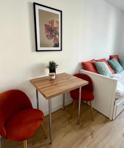 Appartements Dalikyda Le Ptit Nid Stationnement Gratuit : photos des chambres