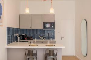 Appartements Studio confortable proche metro et commerces : photos des chambres