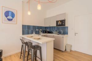 Appartements Studio confortable proche metro et commerces : photos des chambres