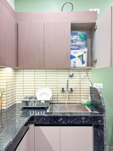 Calm Canopy 1BHK with PVT Balcony & Kitchen