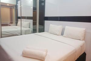 Simply 1BR at 31st Floor Vida View Makassar Apartment By Travelio - 3hvězdičkové hotely ve městě Pampang