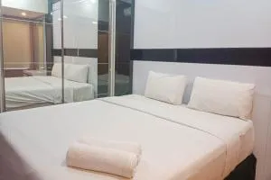Simply 1BR at 31st Floor Vida View Makassar Apartment By Travelio - Manda