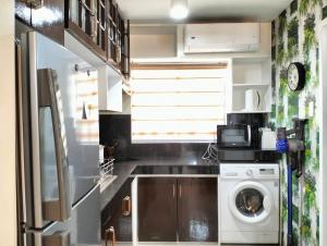 Two-Bedroom AE One Oasis Condominium - Behind SM Ecoland