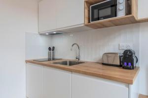 Appartements Grand studio renove, proche tram : photos des chambres