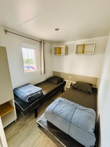 Campings Le 510 mobil-home : photos des chambres