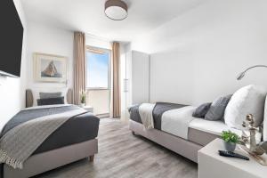 BeachWaveThree- 2OG, barrierearm, Meerblick, Balkon, Kamin, Sauna