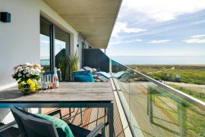 BeachWaveThree- 2OG, barrierearm, Meerblick, Balkon, Kamin, Sauna