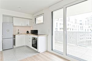 Appartements Spacieux 3 chambres avec balcon : photos des chambres