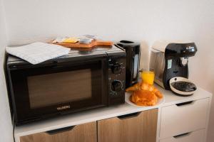 Appartements Le cosy Memorial - Parking - BY PRIMO CONClERGERIE : photos des chambres