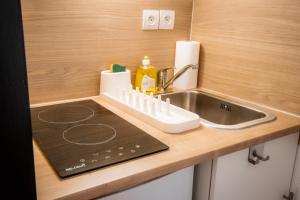 Appartements Le cosy Memorial - Parking - BY PRIMO CONClERGERIE : photos des chambres