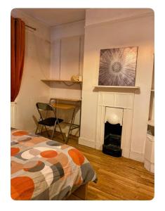 Large room with single bed, work desk and double wardrobe