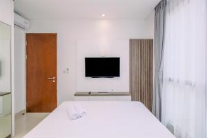 Stunning and Cozy 1BR Apartment at Ciputra World 2 By Travelio