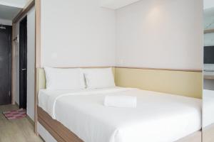 Homey and Cozy Studio Casa De Parco Apartement By Travelio