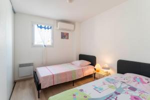 Maisons de vacances Villa climatisee avec piscine : photos des chambres