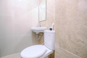 Cozy Stay and New Furnished Studio at Transpark Cibubur Apartment By Travelio