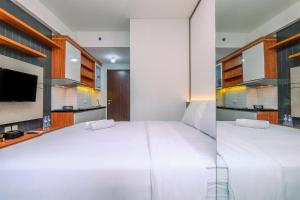Simply and Comfort Design Studio Room at Transpark Cibubur Apartment By Travelio