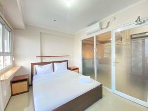 Minimalist and Nice 1BR at Gateway Pasteur Apartment By Travelio