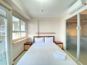 Minimalist and Nice 1BR at Gateway Pasteur Apartment By Travelio
