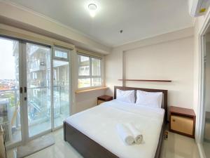 Minimalist and Nice 1BR at Gateway Pasteur Apartment By Travelio