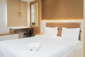 Minimalist and Cozy Studio Apartment at Tuscany Residences By Travelio