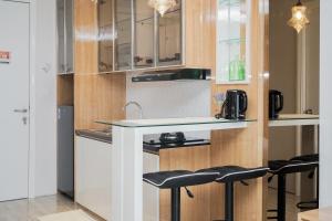 Minimalist and Cozy Studio Apartment at Tuscany Residences By Travelio