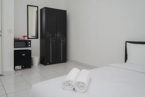 Comfort Studio No Kitchen Apartment at Aeropolis Residence By Travelio