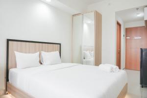 Nice and Cozy Studio at Evenciio Margonda Apartment By Travelio