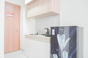 Nice and Cozy Studio at Evenciio Margonda Apartment By Travelio