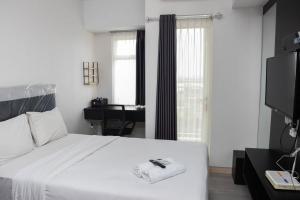 Minimalist Studio at Springlake Summarecon Bekasi Apartment By Travelio