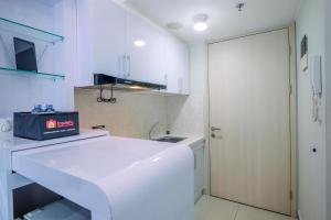 Nice and Comfy Studio at Springlake Summarecon Apartment By Travelio