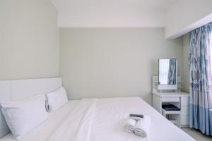 Nice and Comfy Studio at Springlake Summarecon Apartment By Travelio