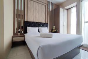 Comfortable and Modern 1BR without Living Room at Amartha View Apartment By Travelio