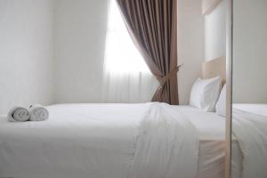 Comfort and Warm 2BR at Parkland Avenue Apartment By Travelio