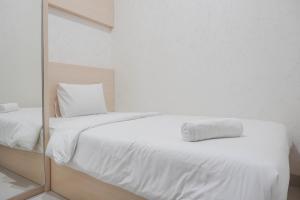 Comfort and Warm 2BR at Parkland Avenue Apartment By Travelio